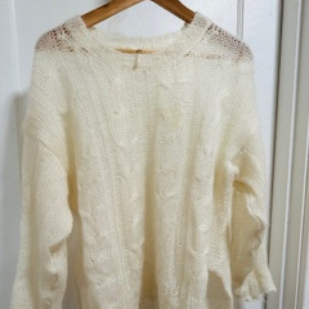 Delicate white cable knit sweater